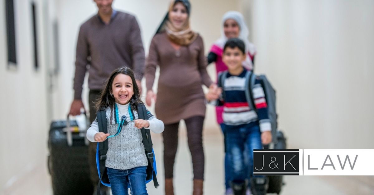 Family walking with luggage